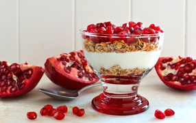 Muesli dessert with yoghurt and pomegranate seeds