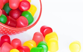 Multicolored jelly candies on white background