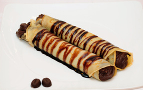 Pancakes with chocolate filling on a plate
