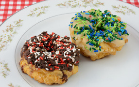 Sweet donuts with glaze on a plate
