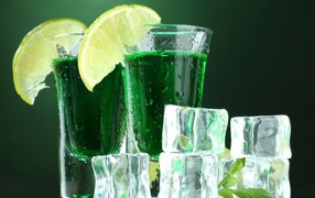 Absinthe with lemon and ice cubes