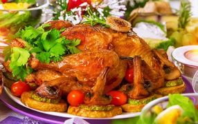 Appetizing baked chicken with mushrooms on a festive table