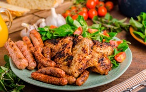 Fried chicken wings with sausages