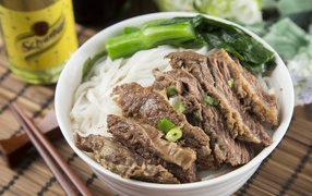 Meat with Chinese rice noodles and greens