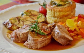 Pork meat on a plate with sauce