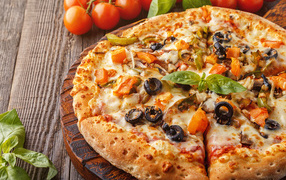 Appetizing pizza with olives on the table