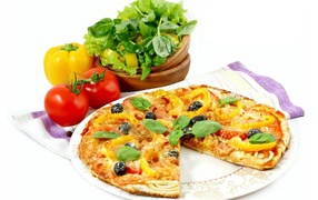 Pizza with tomato, pepper and herbs on a white background