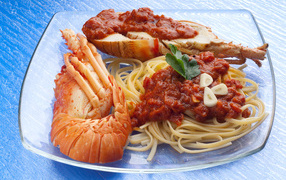 Lobster on a plate with spaghetti and sauce