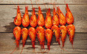 Red boiled shrimps on a wooden table