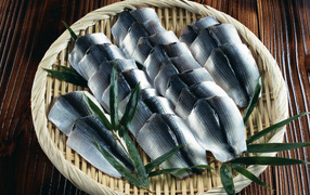 Salted fish fillet on a bamboo plate
