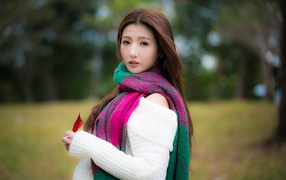 Beautiful Asian with a scarf around his neck