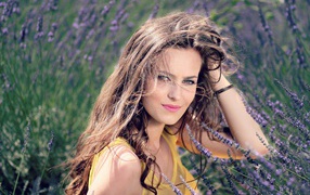 Beautiful brown-haired woman in lavender flowers