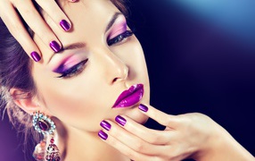 Beautiful brown-haired woman with violet make-up