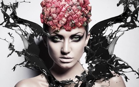 Красивая девушка с макияжем в брызгах черной краски