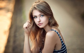 Beautiful green-eyed girl brown-haired