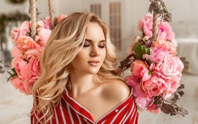Dreamy blonde with peony flowers