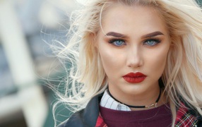 Effective blue-eyed blonde with bright red lips