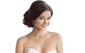 Girl bride with a beautiful hairstyle on a white background