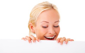 Young blonde with beautiful smile on white background