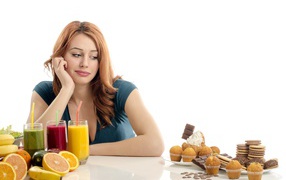 Young girl on a diet on a white background