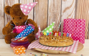 Bear cub, pie and birthday gifts