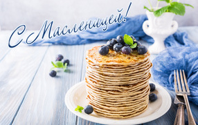 Appetizing thin pancakes with blueberries on Pancake week