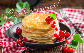 Appetizing thin pancakes with red currants for the Shrovetide feast