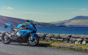 Blue BMW S1000RR motorcycle against the background of water
