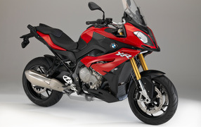 Red motorcycle BMW S1000 XR on a gray background