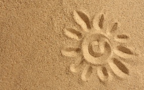 Солнце нарисованное на желтом песке