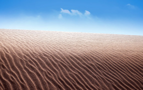 Sand in the desert against the blue sky