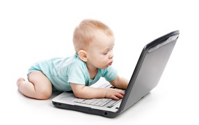 Little boy with a laptop on a white background