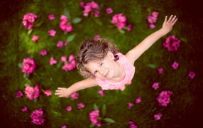 Little girl in a pink dress, top view