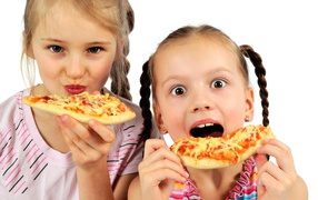 Two little girls with pizza