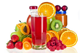 Juice with fresh fruits and berries on a white background