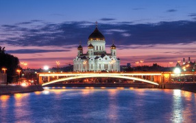 Night bridge at the river against the background of the Cathedral of Christ the Savior, Moscow. Russia