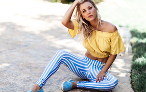 Beautiful blonde in striped pants, actress Kaley Cuoco