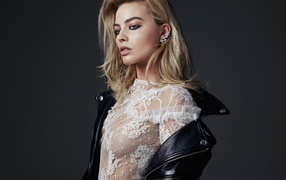 Effective blonde, actress Margot Robbie in a black leather jacket