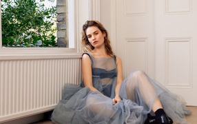 Gentle girl actress Lily James in a beautiful dress