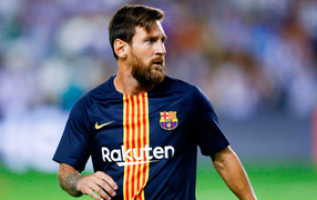 Popular football player Lionel Messi with a beard on the football field.