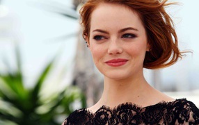 Red-haired smiling girl, actress Emma Stone 2018