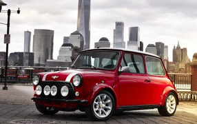 Red Mini Electric Concept, 2018 against the backdrop of the city