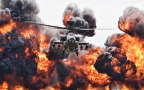 Ударный вертолет армии США Boeing AH-64 Apache в клубе огня