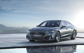 Серебристый автомобиль Audi S7 Sportback TDI 2019 года у воды