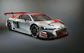 Быстрый автомобиль Audi R8 LMS 2019 года на сером фоне