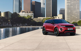 Red Range Rover Evoque D240 HSE R-Dynamic SUV 2019 in the background of the city