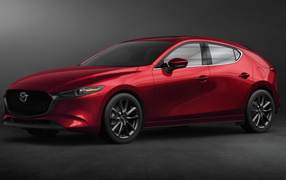 Красный автомобиль Mazda 3, 2020 года на сером фоне