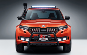 Красный внедорожник Skoda Mountiaq Concept 2019 года на сером фоне