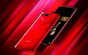 Стильный тонкий смартфон Honor View 20 на красном фоне
