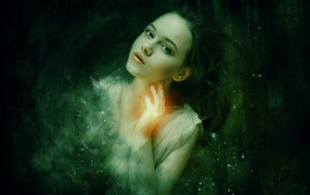 Fantastic girl on a background of dark forest